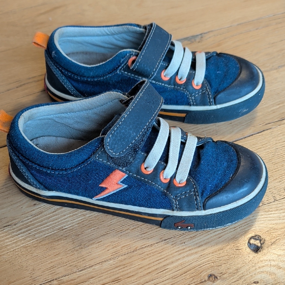 See Kai Run  Navy Blue Lightning Sneaker with Orange Accents.